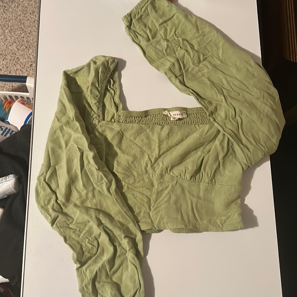 Green cropped top with flared sleeves